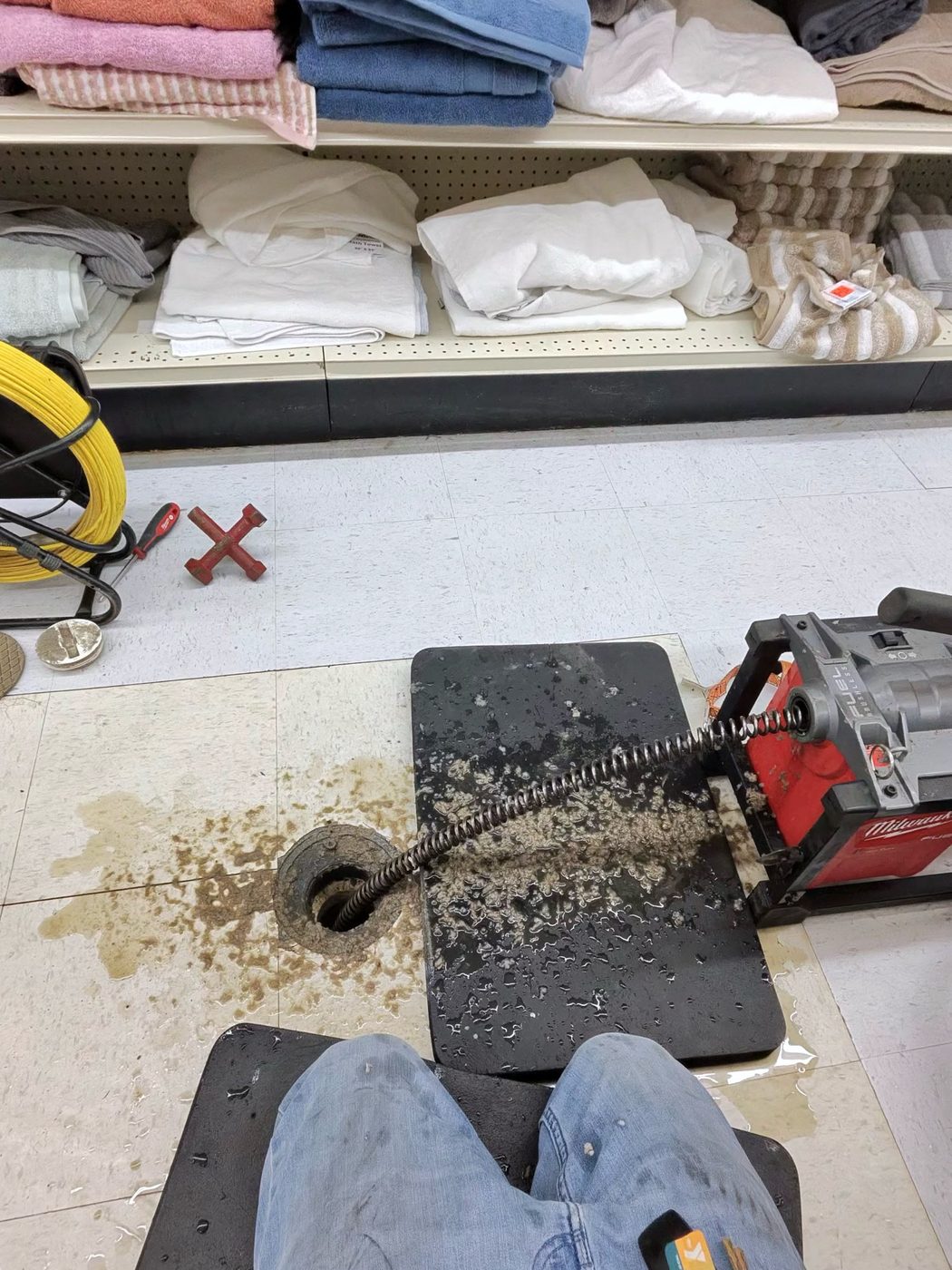 Heavy-duty drain cleaning machine snaking a stubborn floor drain in Seminole, FL